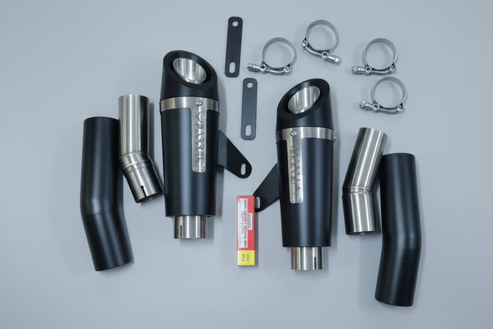 Exhaust system components on a wooden surface